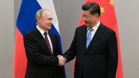FILE PHOTO: Russian President Putin meets with Chinese President Xi during their meeting on the sideline of the BRICS summit in Brasilia