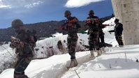 Army personnel patrolling in heavy snow along China border